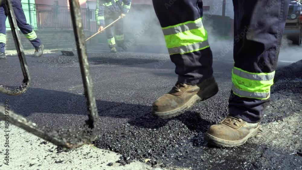 Road Worker Pushing a Wheelbarrow Over Hot Tarmac in Slow Motion. Men ...