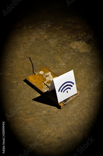 Disarmed Mouse Trap with Wireless Symbol. Internet security and cyber crimes