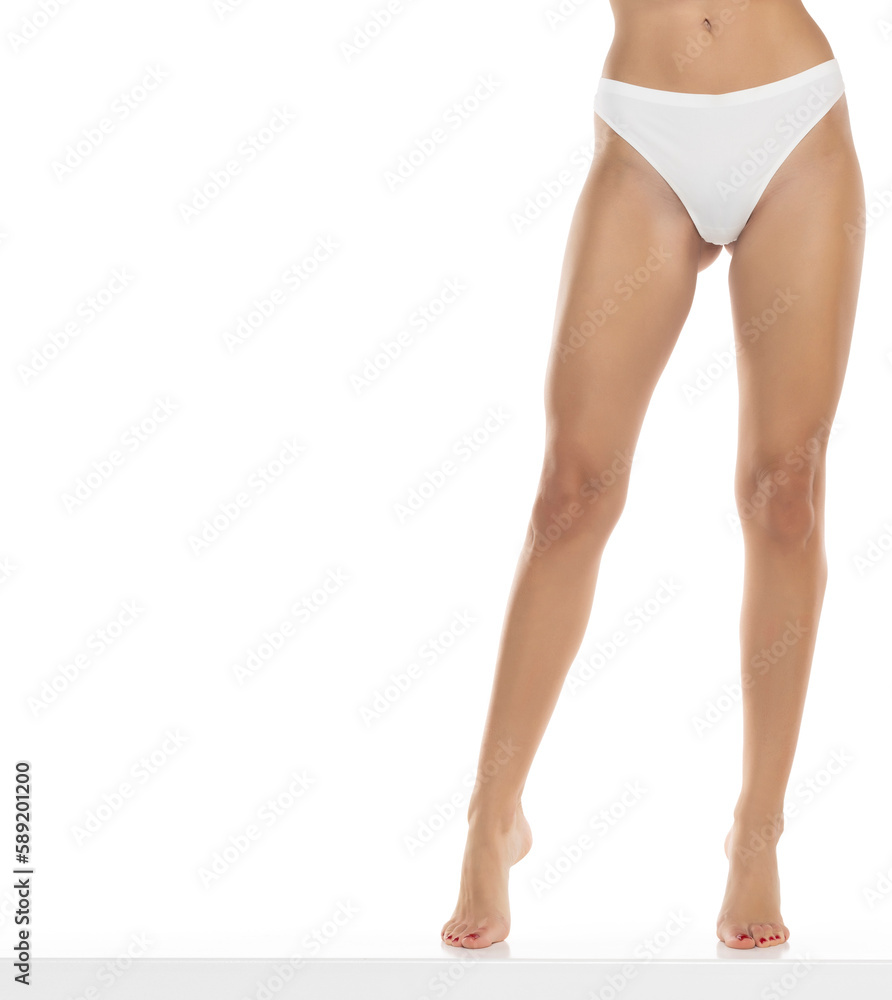 Perfect female legs in underwear on a white background. Front view Perfect female legs in underwear on a white background. Front view