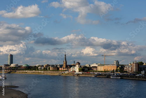 View to the city, river shore and clound in blue sky