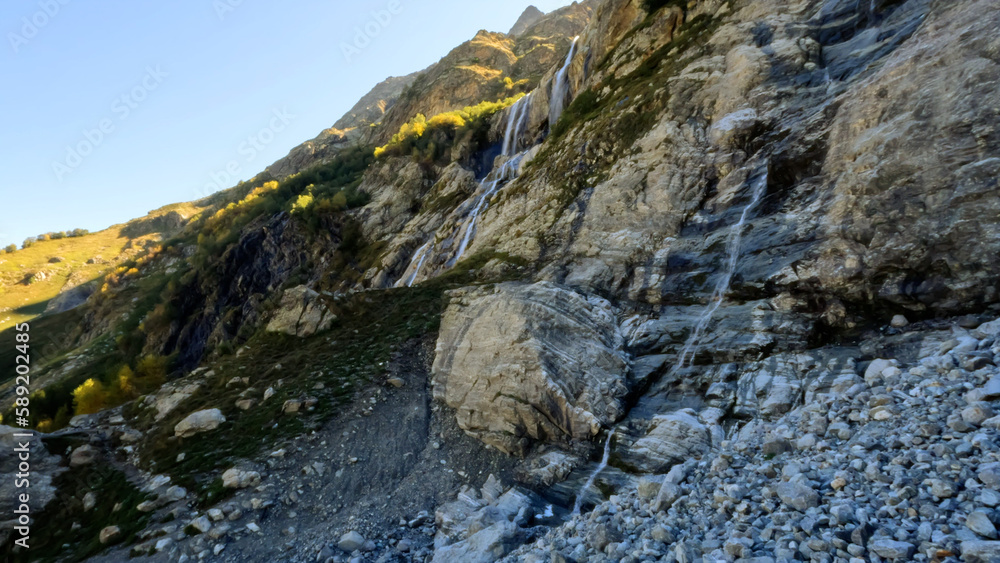 pretty mountain highland fast waterfall at summer day - photo of nature pretty mountain highland fast waterfall at summer day - photo of nature