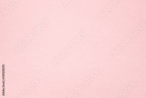 Old vintage pale pink paper surface texture close up