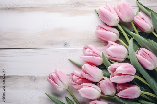 Pink tulips on white vintage wooden background