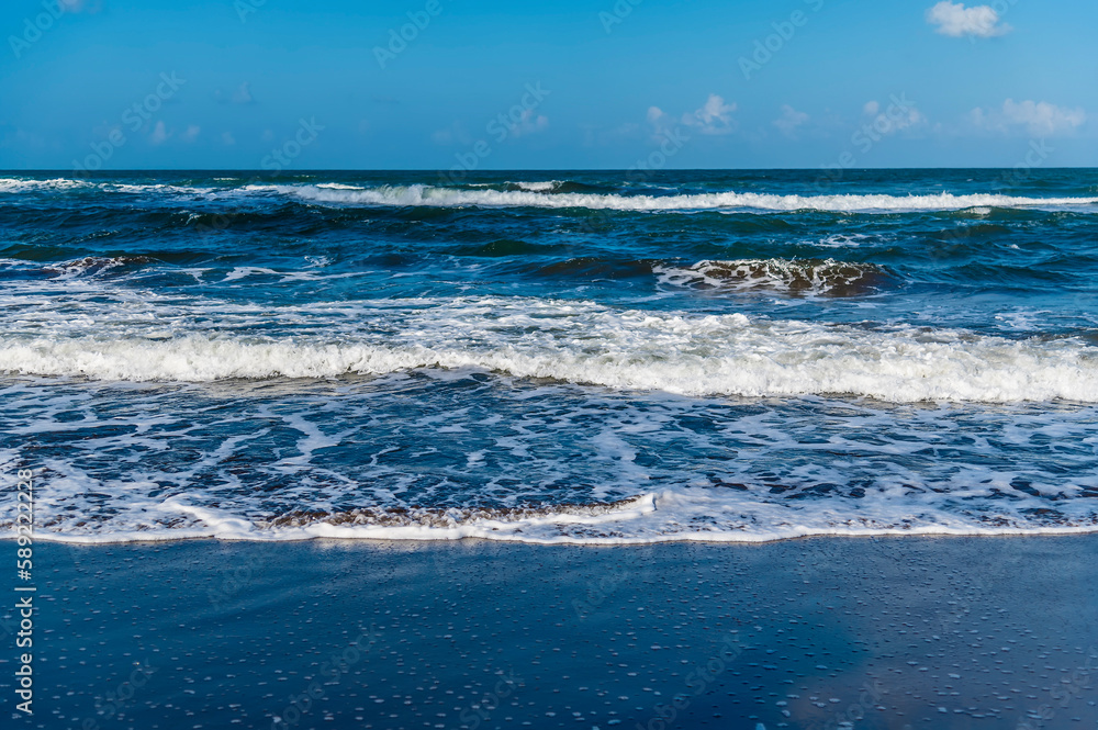 A view of waves offshore from the beach at Tortuguero in Costa Rica during the dry season