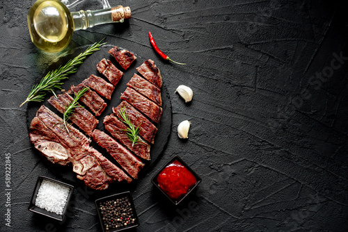 grilled T-bone steak on stone background with copy space for your text