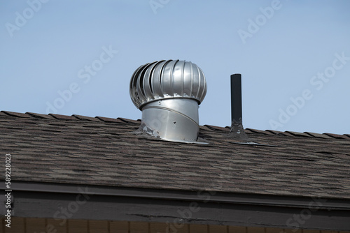 фотографія A metal vent on a house roof
