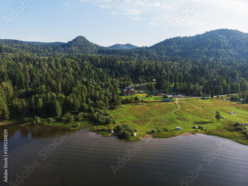 Coast of the Teletskoe Lake at the Altai Mountains on a sunny summer morning photo