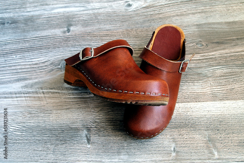 Obraz na plátně clogs on the panel floor