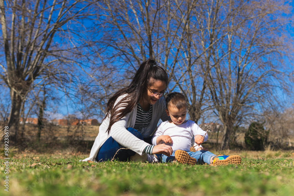 Mother and son playing together in park Mother and son playing together in park