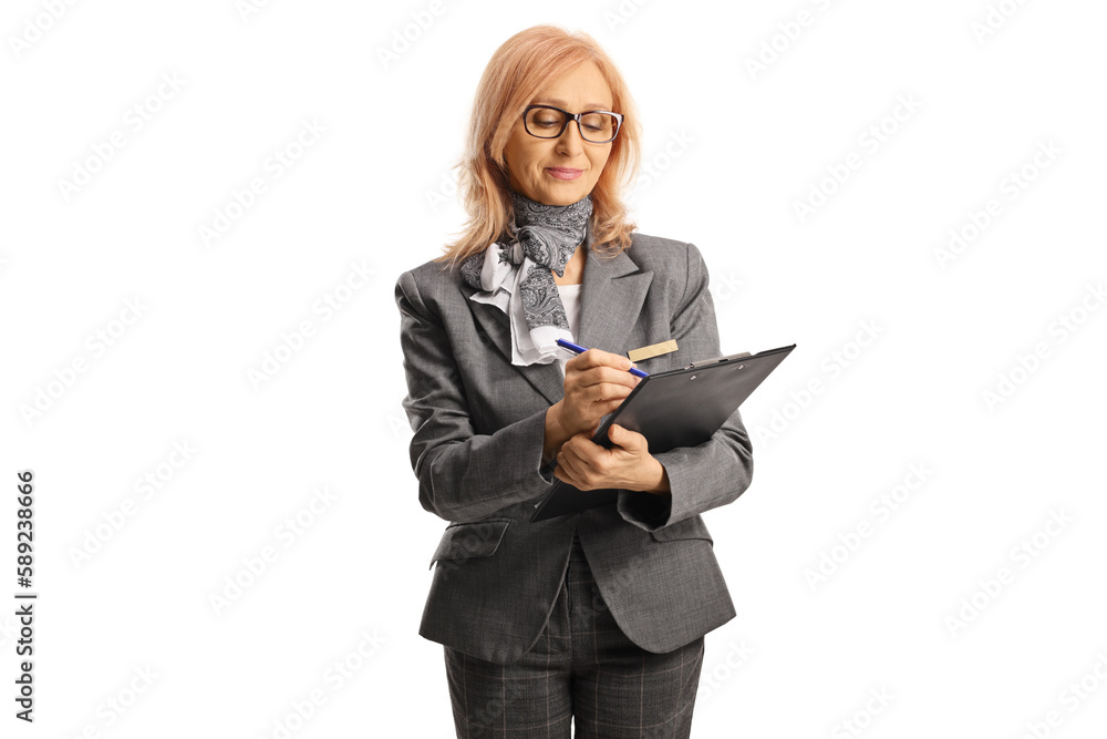 Mature woman with glasses wearing formal clothes and writing on a clipboard Mature woman with glasses wearing formal clothes and writing on a clipboard