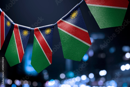 A garland of Namibia national flags on an abstract blurred background