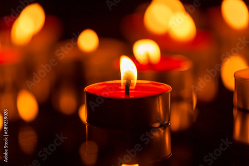 candle Burning candles on a dark memorial day surface Many burning candles with a shallow depth of field.