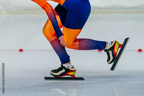Tableau sur toile close-up female skaters in bright skin suit run in speed skating competition, wi