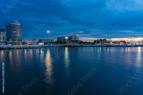 Pattaya, Thailand - September 5 2020 : Market walking area with many street shops and hotels in twilight view from the middle of the sea.