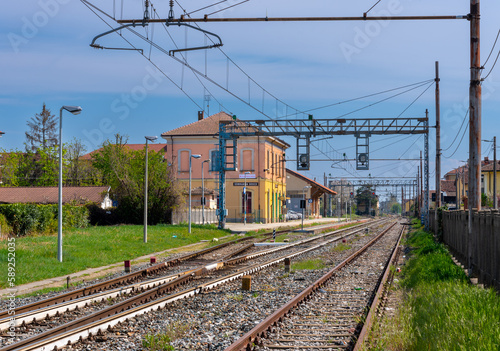 Sommariva del Bosco, Cuneo, Italy - 05 April 2023: Railway station overlooking the tracks of the railway line between Alba and Turin