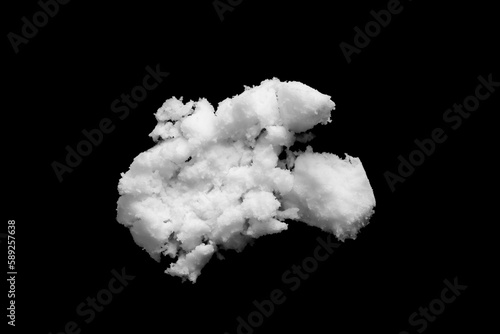 White snow isolated on black background close up