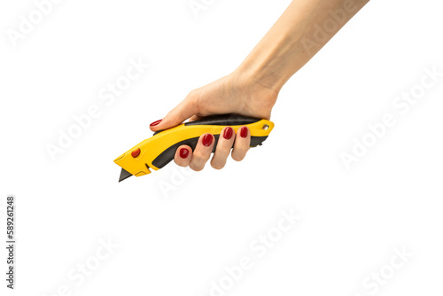 Segmented blade or snap-off blade utility knife in woman's hand isolated on white background.