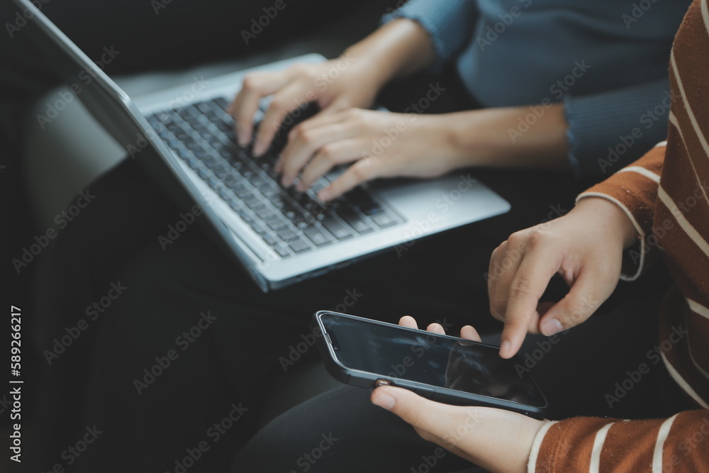 Beautiful woman sitting on a outdoors and using at laptop. Woman and friend having fun with new technology and shopping online at outdoor place. Beautiful woman sitting on a outdoors and using at laptop. Woman and friend having fun with new technology and shopping online at outdoor place.