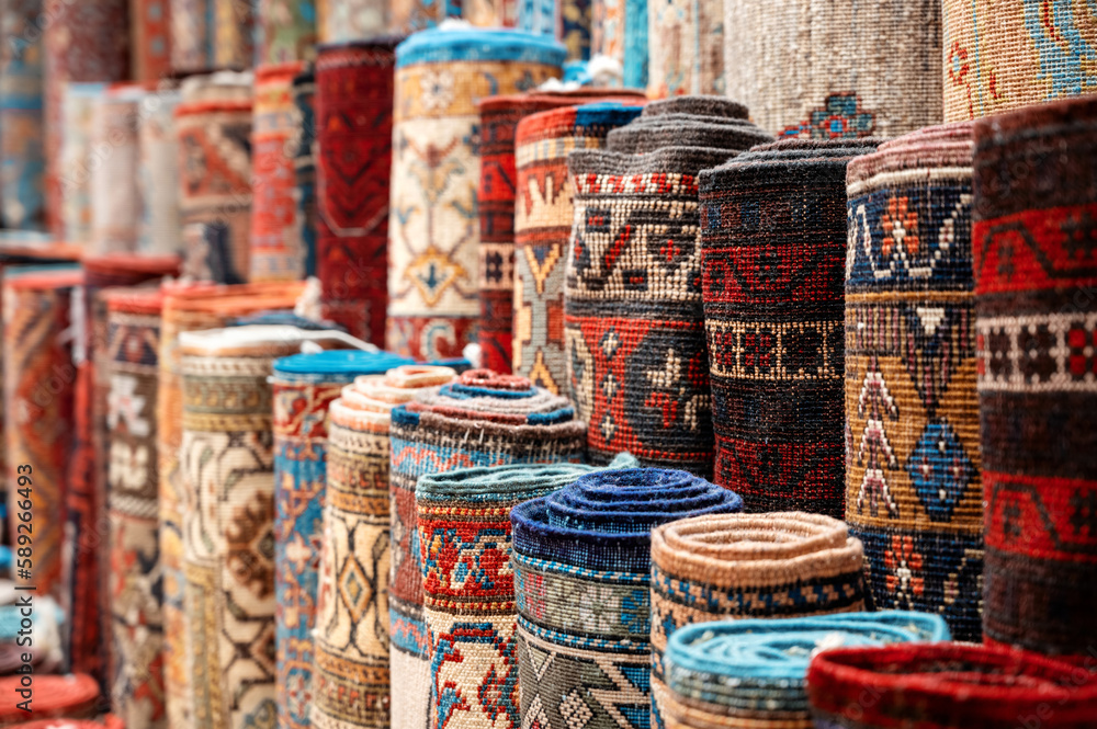 Multiple carpets at the Grand Bazaar in Istanbul, Turkey - obrazy, fototapety, plakaty 