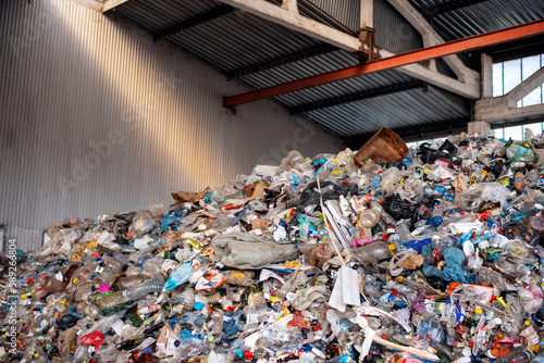 Heap of plastic garbage at waste sorting plant © frimufilms