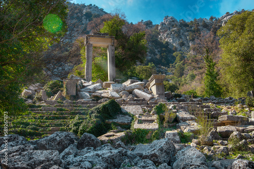 Arch of  Hadrian's Temple in ancient abandoned city Termessos in mountains Antalya region, Turkey photo