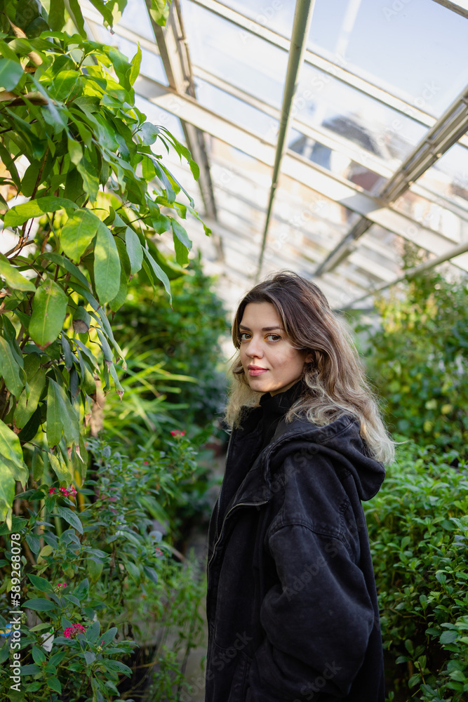 Young woman in botanical garden. She explore different types of trees. Botany, arboretum, hortus botanicus in amsterdam, netherlands. Young woman in botanical garden. She explore different types of trees. Botany, arboretum, hortus botanicus in amsterdam, netherlands.