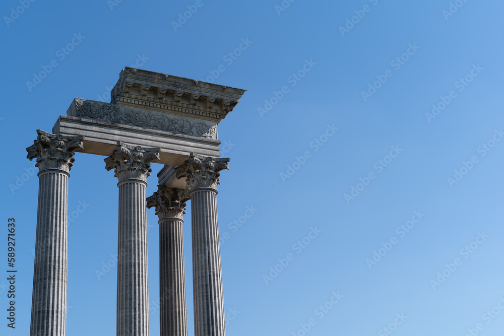 part of ancient greek temple with blue sky