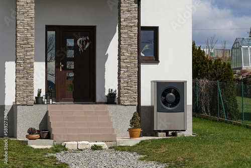 Obraz na płótnie Economic heat pump in modern passive house using green energy, future of heating concept w salonie
