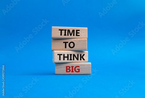 Time to think big symbol. Wooden blocks with words Time to think big. Beautiful blue background. Business and Time to think big concept. Copy space.