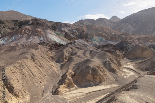 Scenic view of colorful geology of multi hued Amargosa Chaos rock formations in Death Valley National Park, Furnace Creek, California, USA. Barren desert landscape of Artist Palette in Black mountains photo