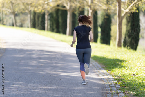 Adult woman jogging in the park
