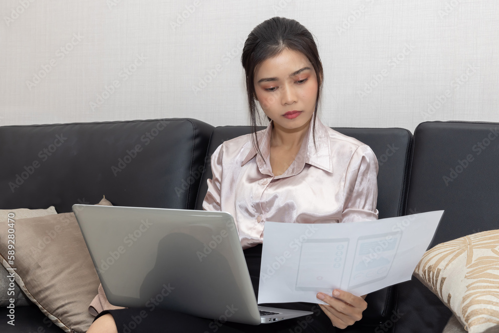 Businesswoman Working with Her Laptop on Sofa Businesswoman Working with Her Laptop on Sofa