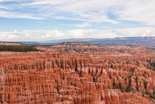 Panoramic aerial view of massive hoodoo sandstone rock formations in Bryce Canyon National Park, Utah, USA. Natural unique amphitheatre sculpted from the reddest rock of the Claron Formation. Awe © Chris
