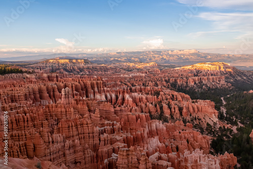 Aerial sunset view of massive hoodoo sandstone rock formation boat mesa in Bryce Canyon National Park, Utah, USA. Last sun rays touching on natural unique amphitheatre sculpted from the red rock