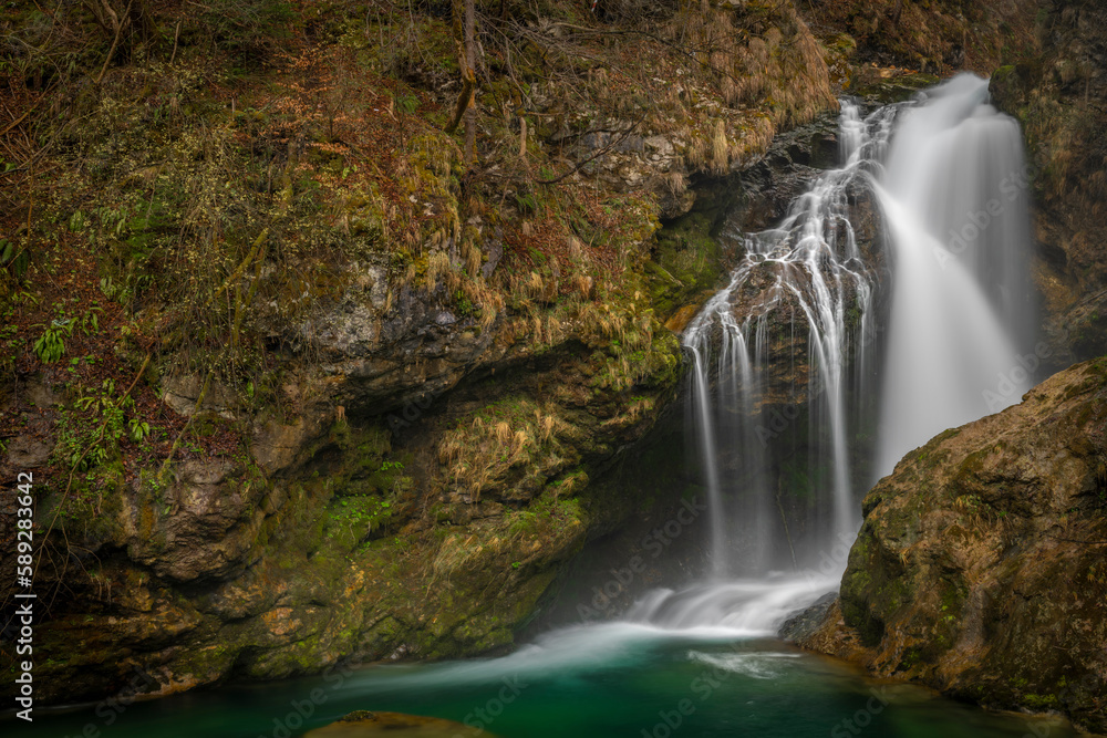 Obraz premium Sum waterfall on Radovna river in spring color fresh Slovenia