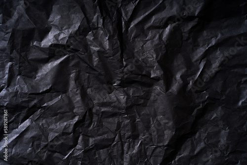 Black background wrapping paper with crumpled texture. Background for your design.