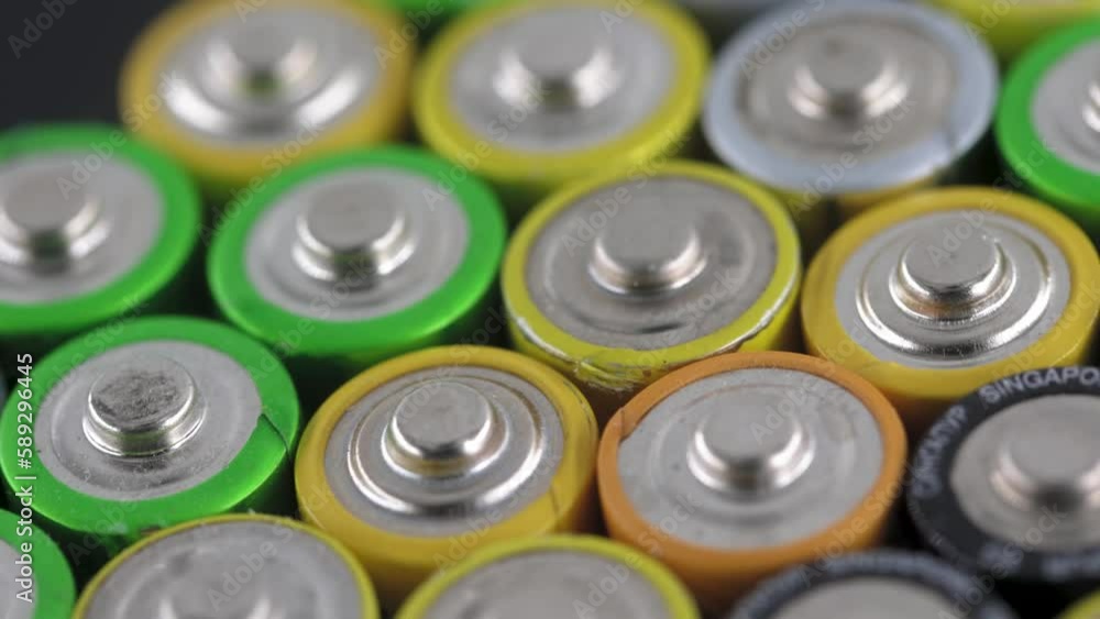 Close up of positive ends of AA batteries, of electric batteries and accumulators AAA Close up of positive ends of AA batteries, of electric batteries and accumulators AAA