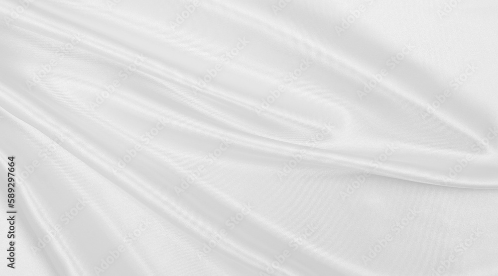 Smooth elegant white silk or satin luxury cloth texture as wedding background. Luxurious background design