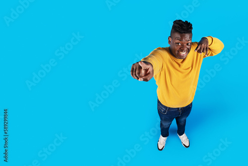 Check This. African American Man Pointing At Copy Space With Two Hands