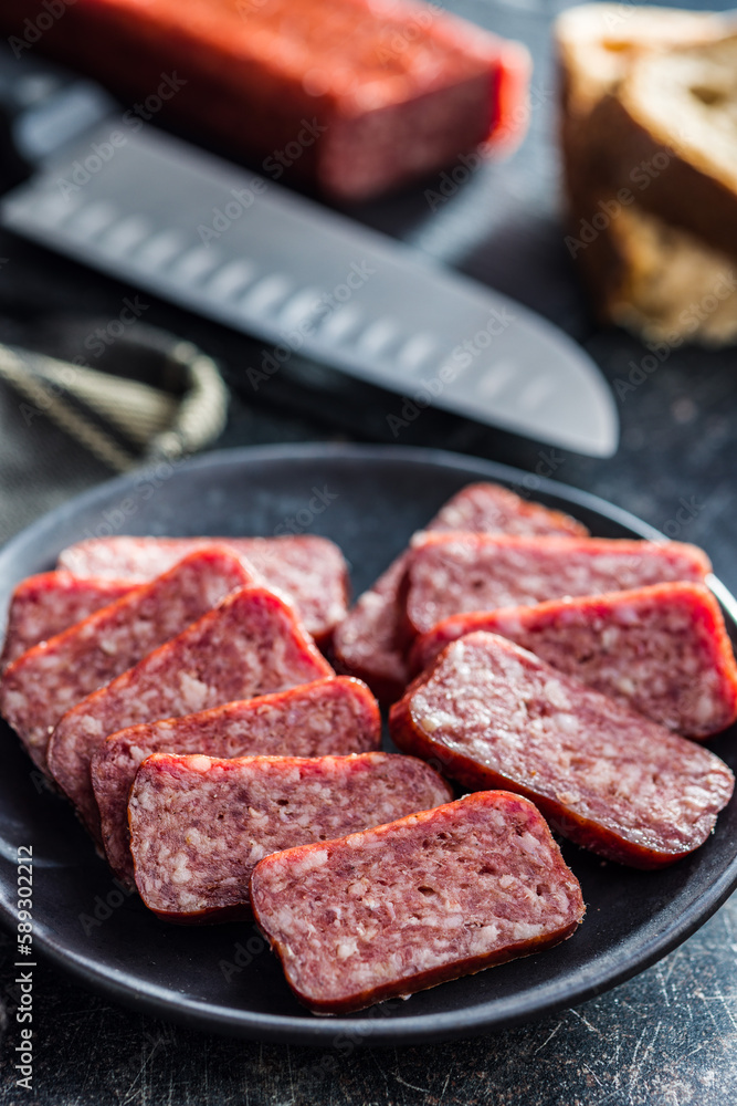 Smoked .sausage. Sliced salami on plate. Smoked .sausage. Sliced salami on plate.
