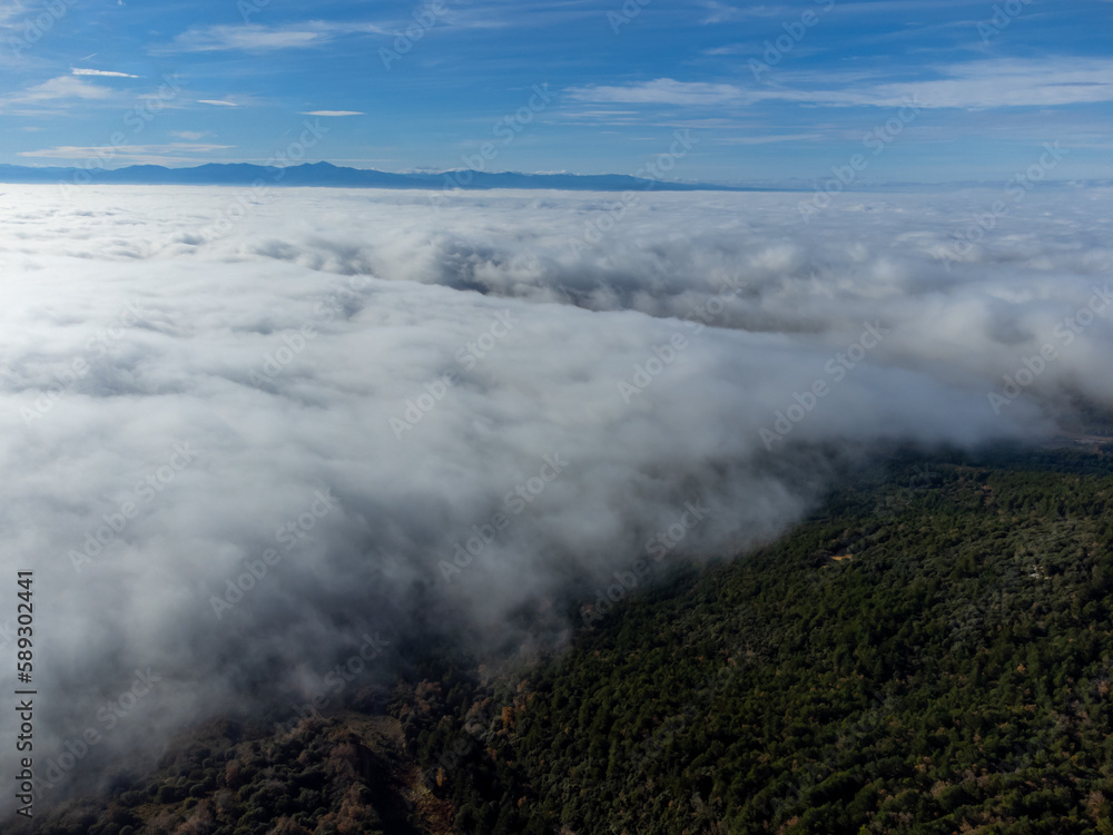 Sea of white clouds above Rioja Alavesa valley as seen from sunny point of view Balcon De La Rioja, Spain in winter