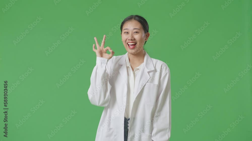 Asian Woman Doctor Showing Okay Gesture And Smiling On Green Screen Background In The Hospital
Asian Woman Doctor Showing Okay Gesture And Smiling On Green Screen Background In The Hospital