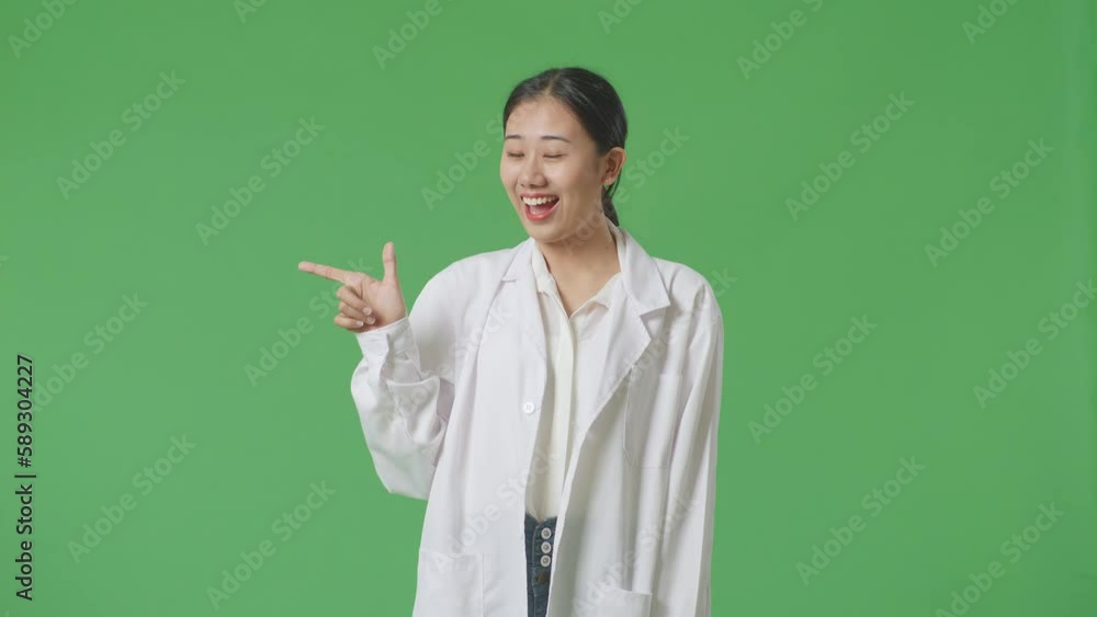 Asian Woman Doctor Smiling And Pointing To The Side On Green Screen Background In The Hospital
Asian Woman Doctor Smiling And Pointing To The Side On Green Screen Background In The Hospital