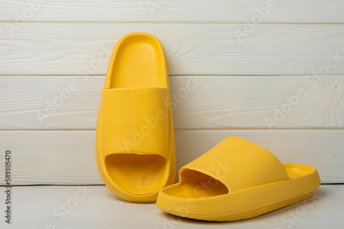 Home slippers on a white texture background. Indoor shoes. Flatley. Home cozy slippers for comfort. Close-up. Place for text. Copy space.