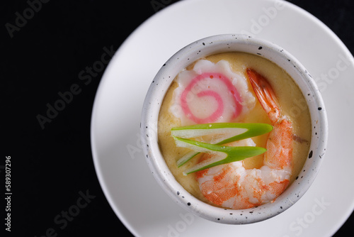 Japanese Traditional food Eggs Custard Chawanmushi isolated in black background