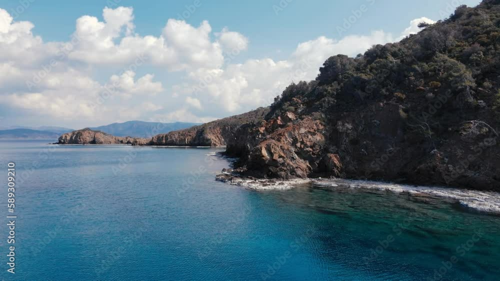 Rocky shore of Aegean sea with turquoise crystal sea water. Aerial wide shot Rocky shore of Aegean sea with turquoise crystal sea water. Aerial wide shot
