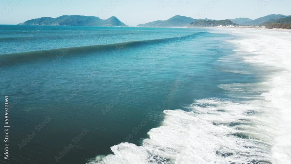 Aerial view of the breaking wave. Brazilian coastline of the Atlantic Ocean with waves. Morro das Pedras beach break Aerial view of the breaking wave. Brazilian coastline of the Atlantic Ocean with waves. Morro das Pedras beach break