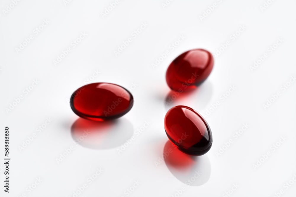 Red krill oil kapsules on bright background Red krill oil kapsules on bright background