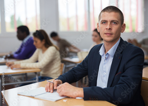 Lesson in the classroom of the university - students at their desks