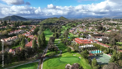 Aerial view of residential neighborhood surrounded by golf and valley during cloudy day in Rancho Bernardo, San Diego County, California. USA. 
